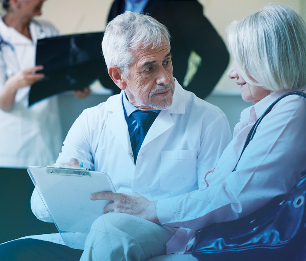 doctor speaking with older patient about results
